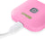 Close up of the TENS machine Comfee Power Square plugged into its charging cable. The TENS machine is pink in colour and you can see the Comfee Relief logo and the on/off button. The Background is white.